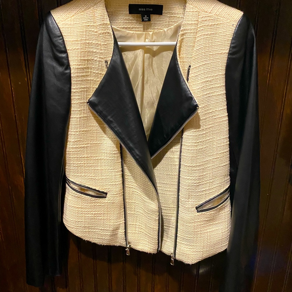 Cream tweed jacket with black sleeves